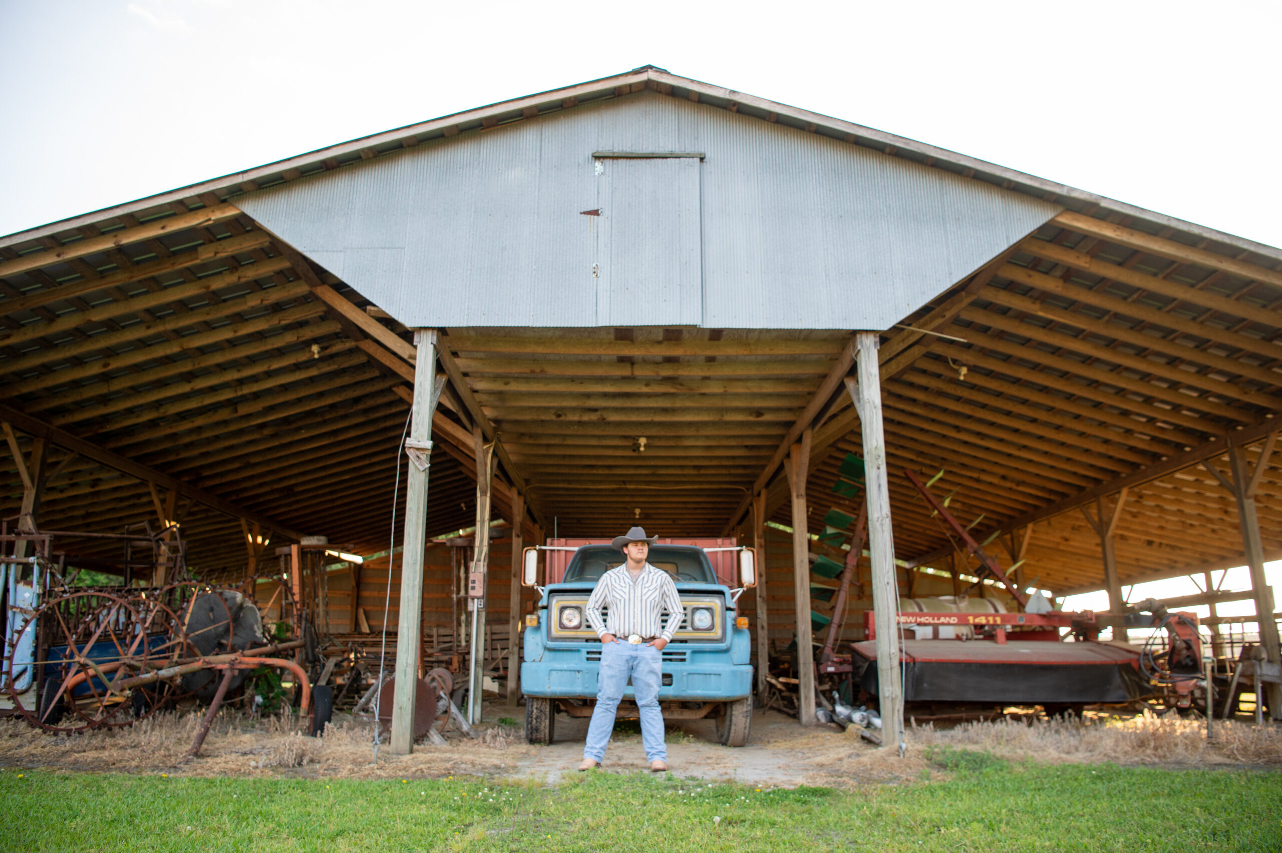Cowboy Senior Session with truck, tractor and puppy.