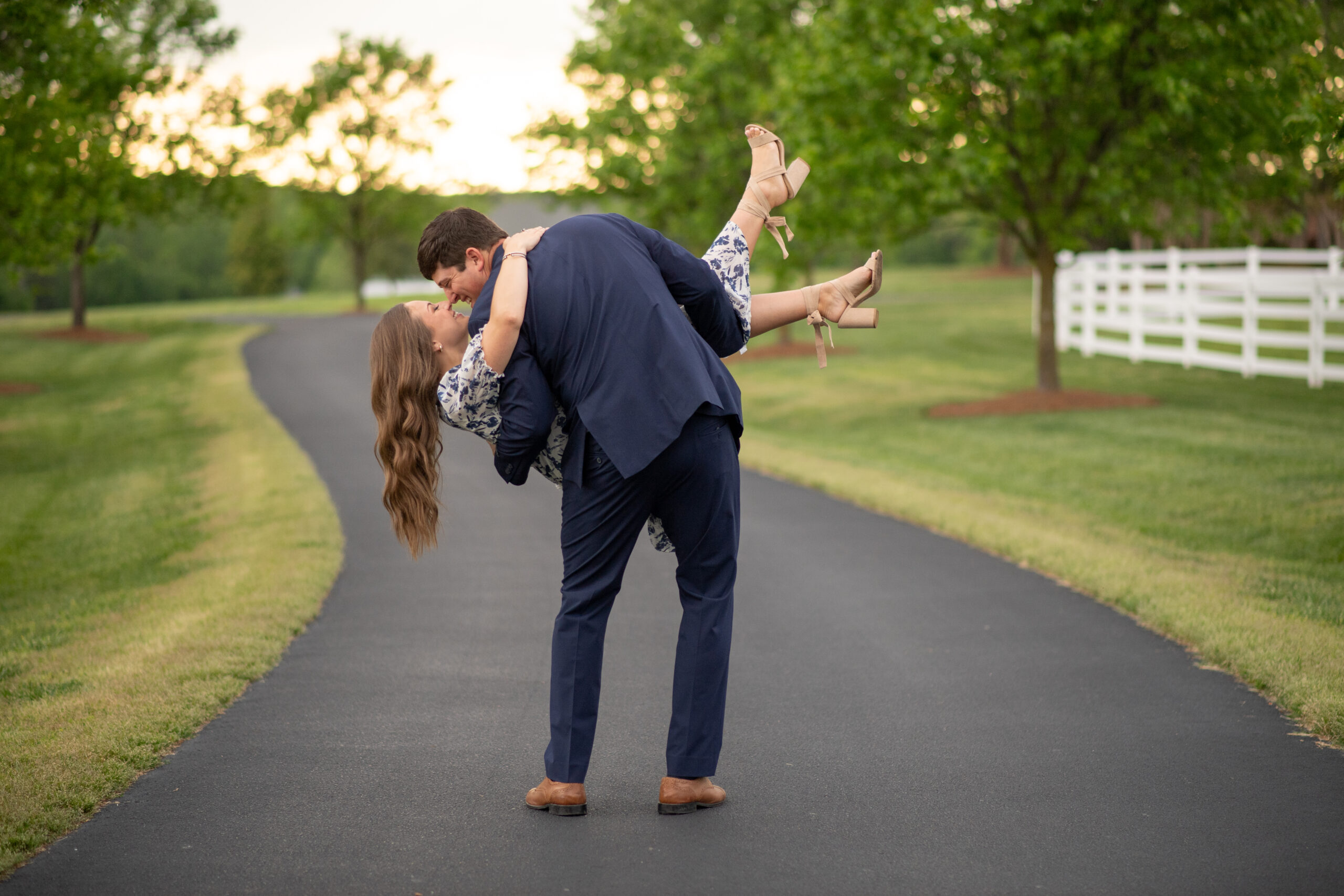 Newly engaged couple share kiss and romantic dip in Littleton, NC
