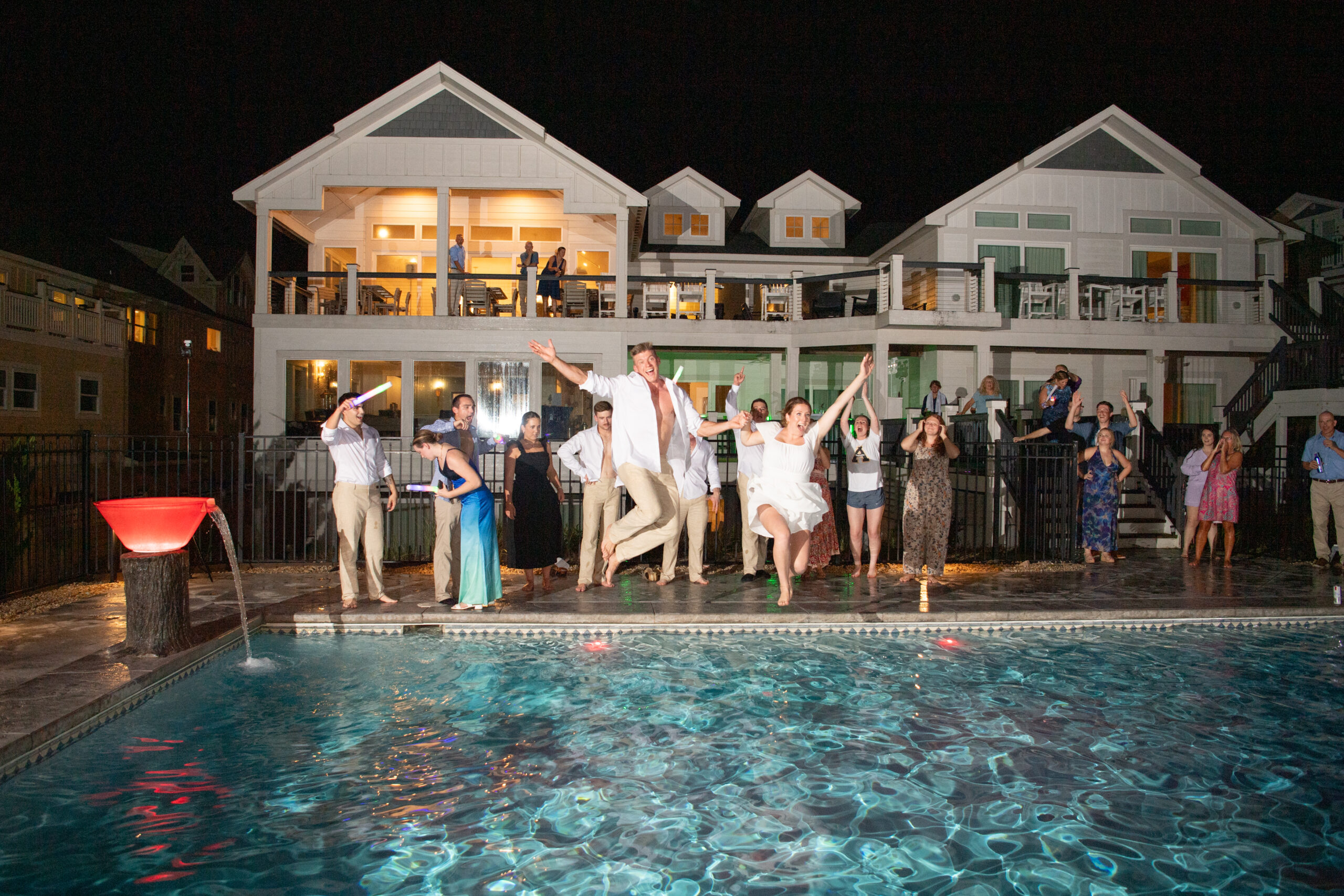 Epic wedding pool jump in Kill Devil Hills, NC.
